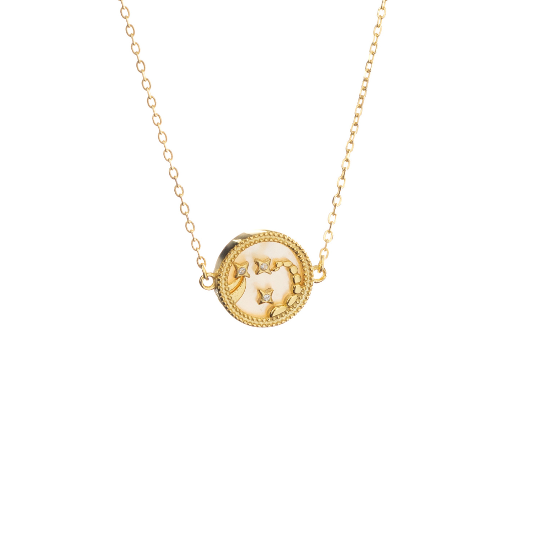 Gold Scorpio necklace with scorpion design and bold star accents, symbolizing depth and mystery.