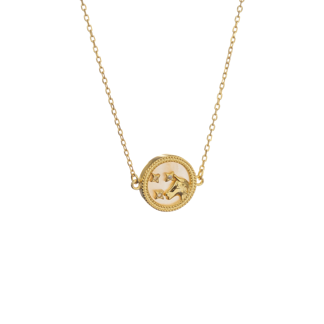 Gold Taurus necklace with bull motif and celestial stars, celebrating grounded beauty and inner power.