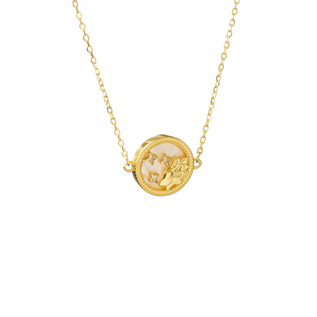 Gold Leo necklace with lion symbol and radiating stars, embodying confidence and vibrant energy.