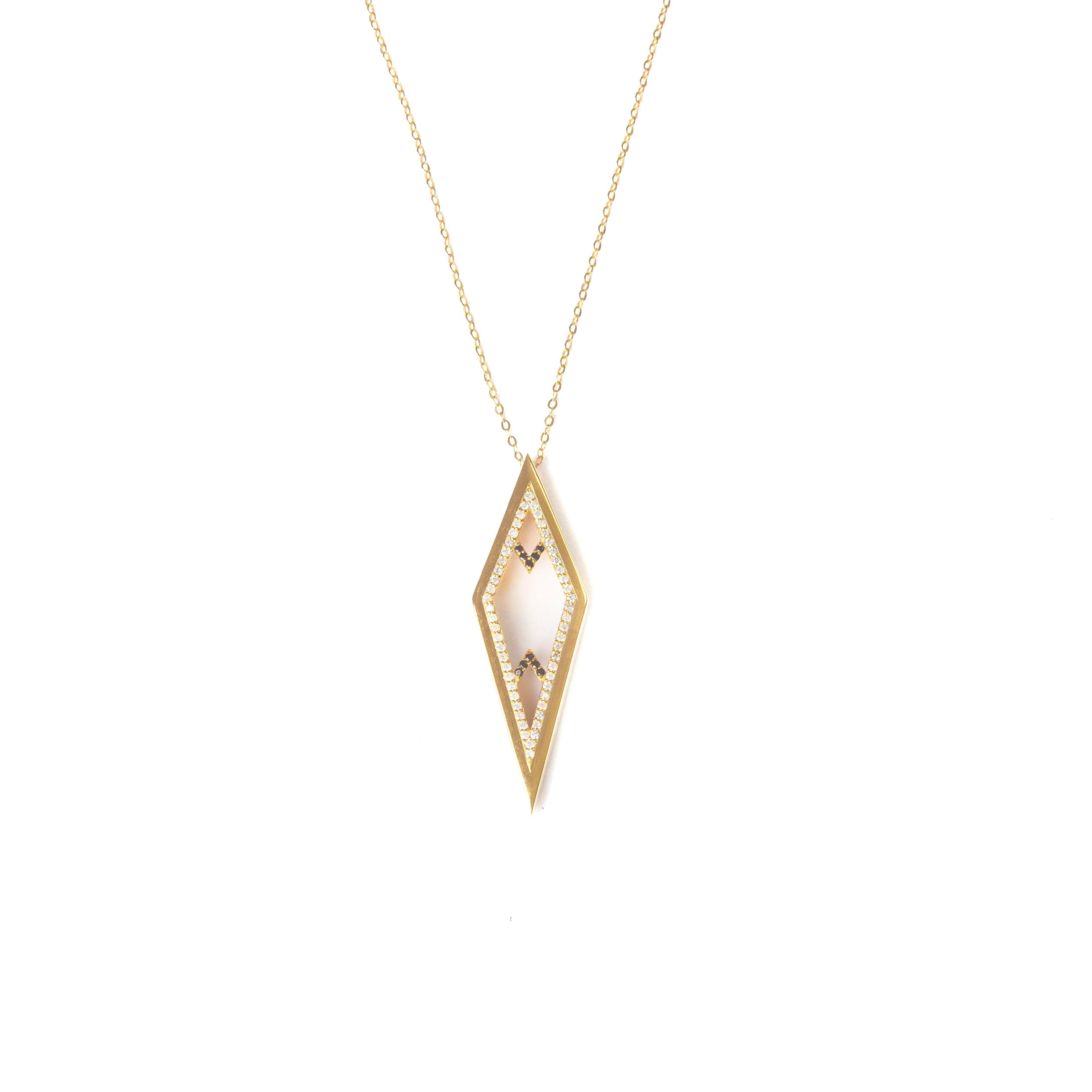 An elegant gold necklace showcasing a refined geometric pendant, intricately set with black stones and white diamonds — a bold yet graceful piece embodying contemporary Arabian sophistication.