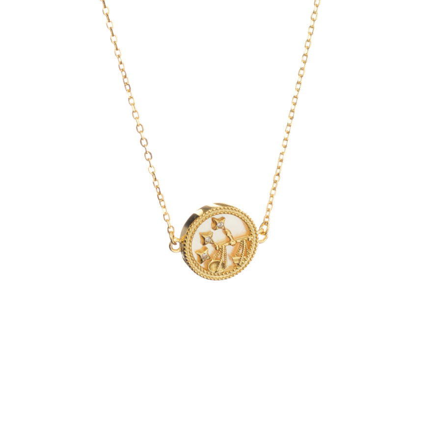 Libra zodiac necklace in sterling silver with gold finish, displayed on white background with balanced Libra symbol