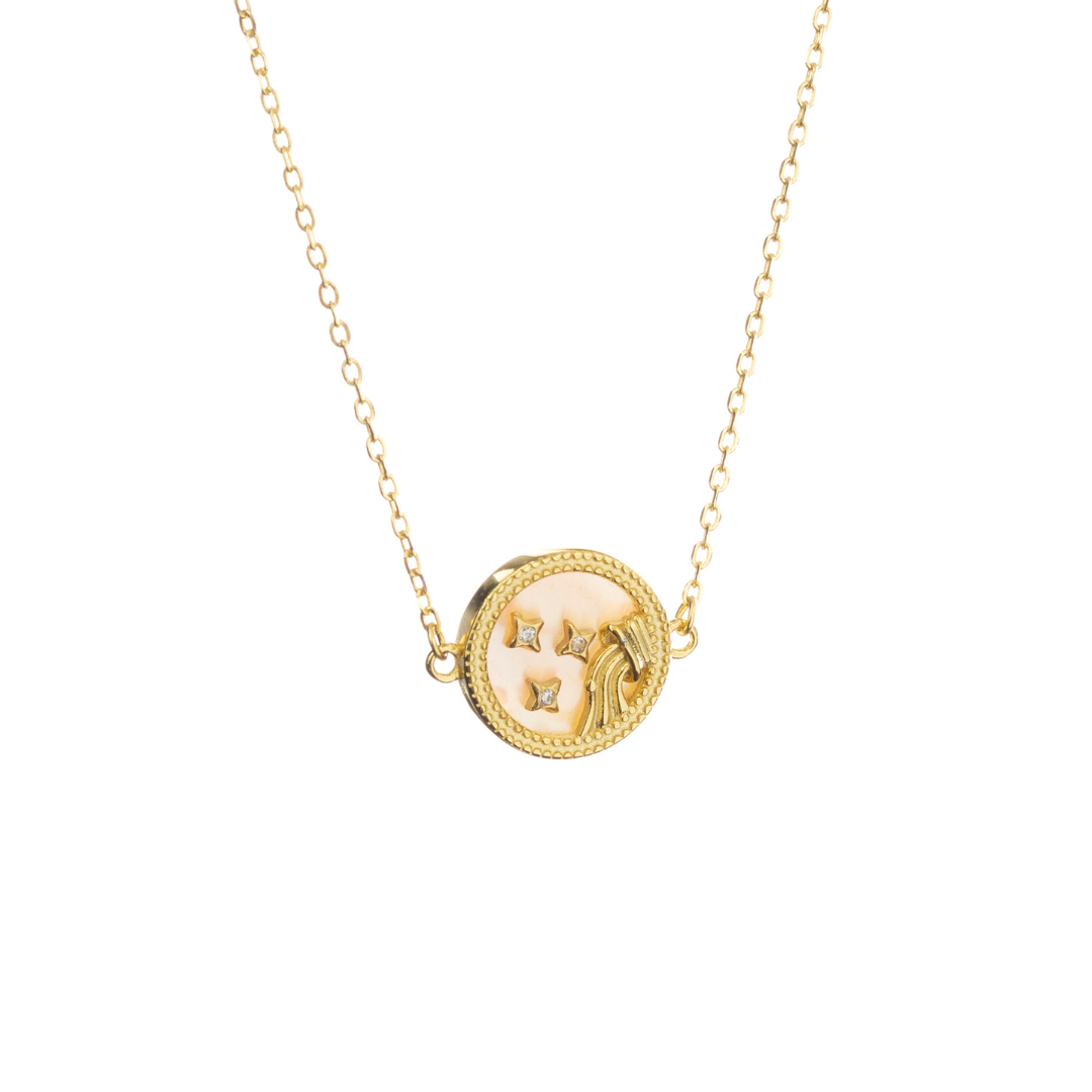 Gold Pisces necklace with fish motif and delicate stars, capturing imagination, emotion, and flow.