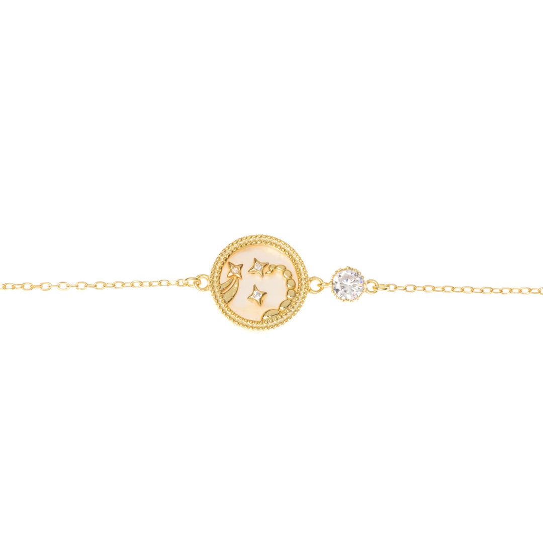 Scorpio zodiac bracelet in golden-painted sterling silver, shown on white background with artistic Scorpio design